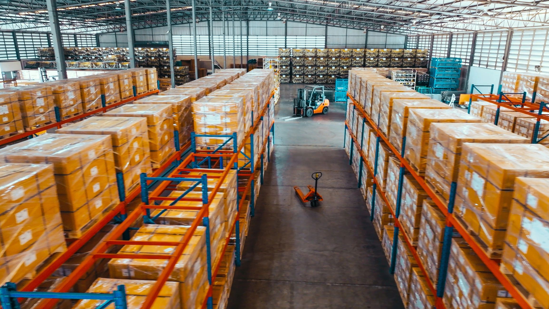 Warehouse shelves with packaged orders ready for fulfillment